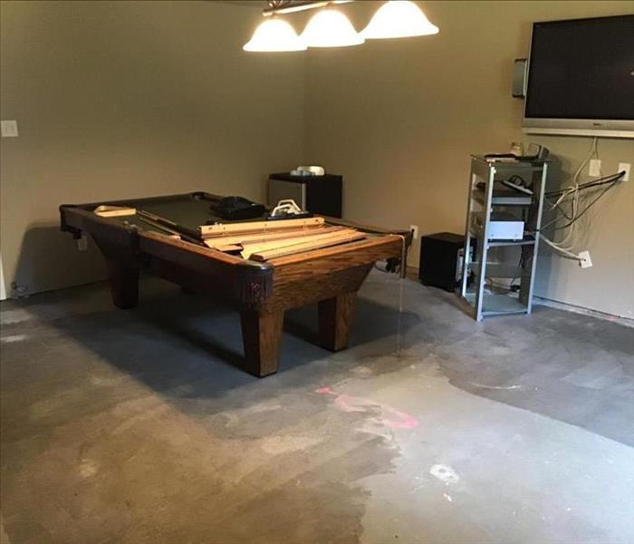 Game room with pool table against wall 
