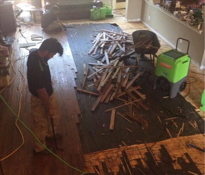 Pile of floorboards in living room 