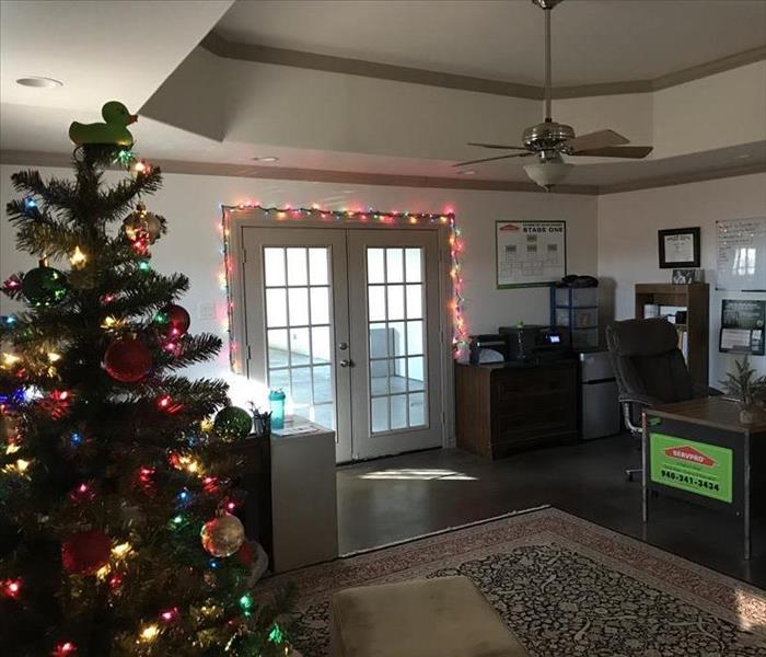 Christmas tree with a Servpro duck on top of the tree